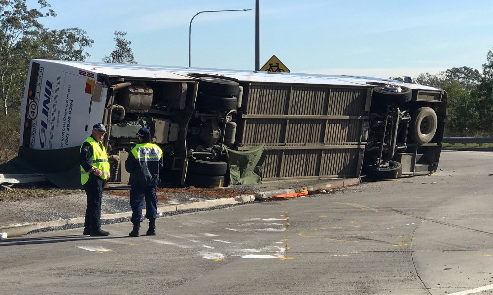 Police officers stand at the scene of a bus crash in New South Wales Hunter Valley.  Darren Pateman/AAP/dpa via Reuters Connect